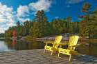 Canada-Ontario-Grundy Lake Provincial Park. Muskoka chairs on lake dock. Art Print